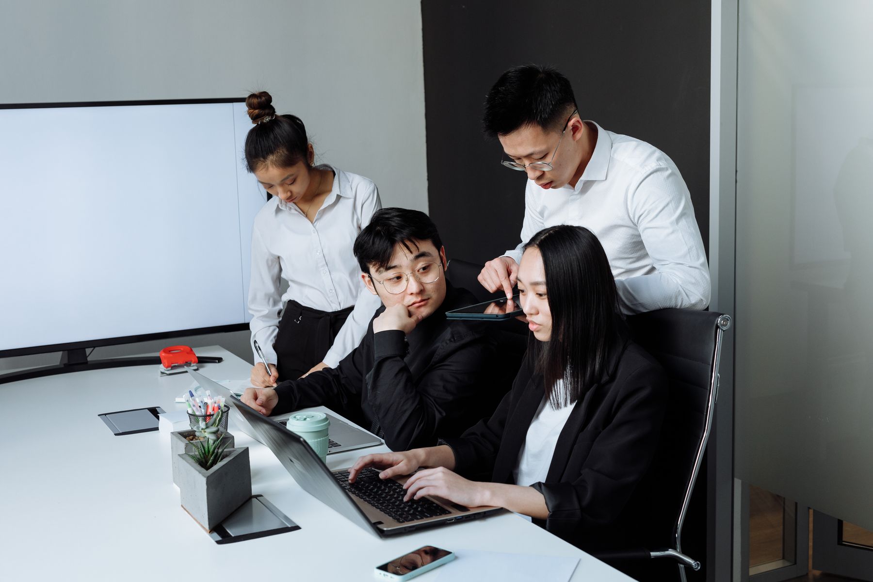 A team in discussion around an office table